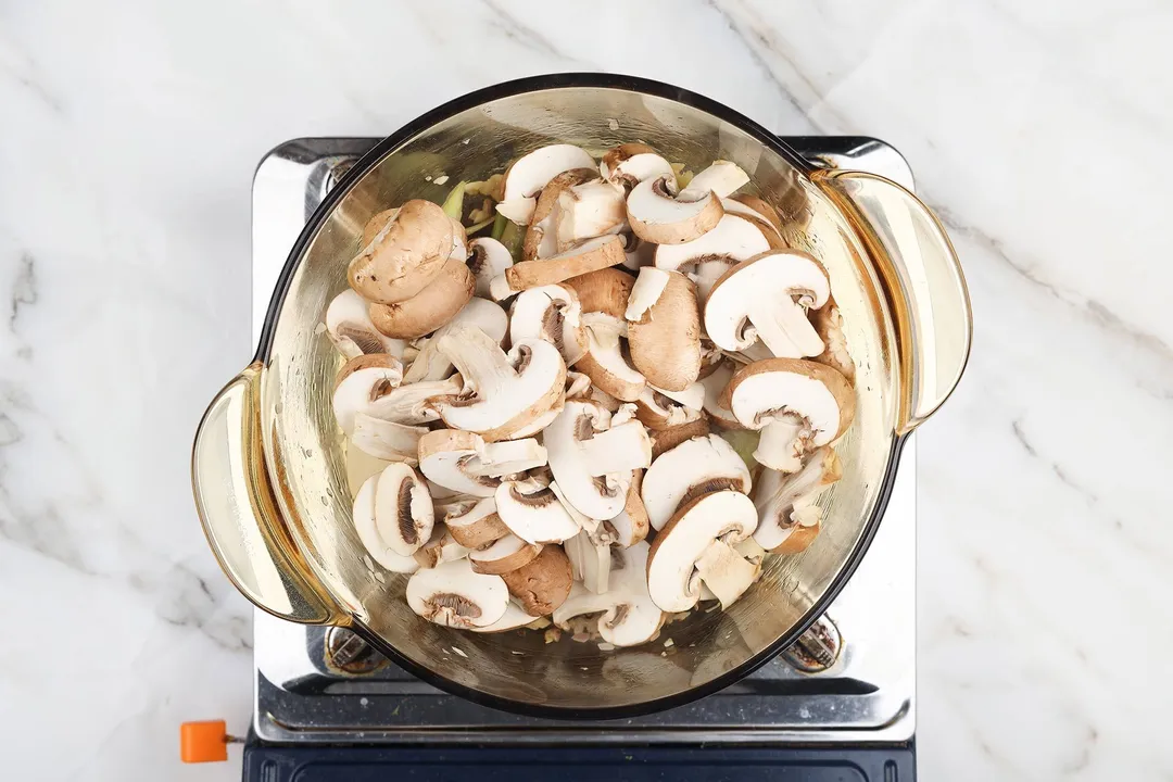 slices mushroom in a pot