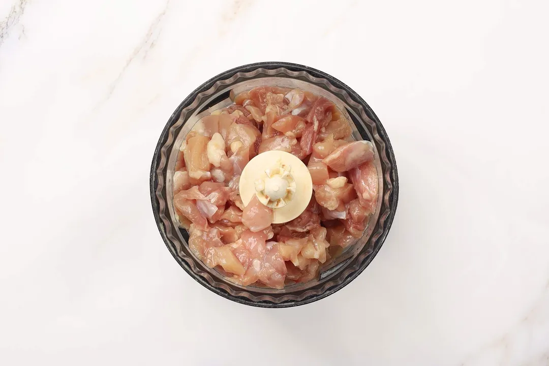 chopped chicken in a food blender