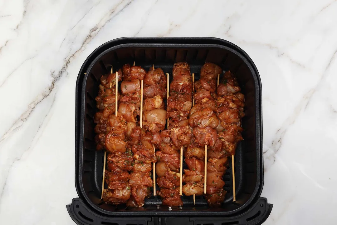 seasoned chicken in air fryer basket