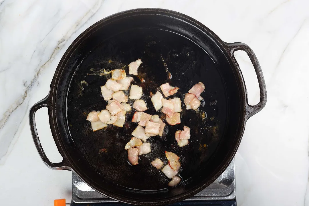 chopped bacon in cast iron skillet
