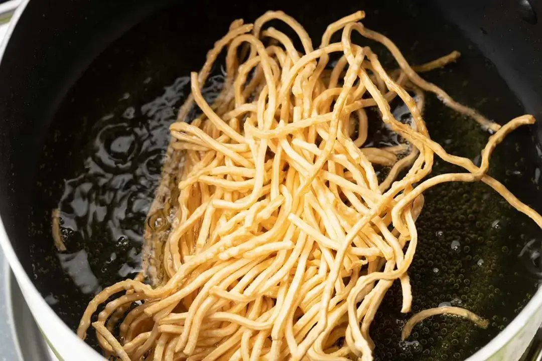 Step 3 Deep fry the egg noodles for chinese chicken salad