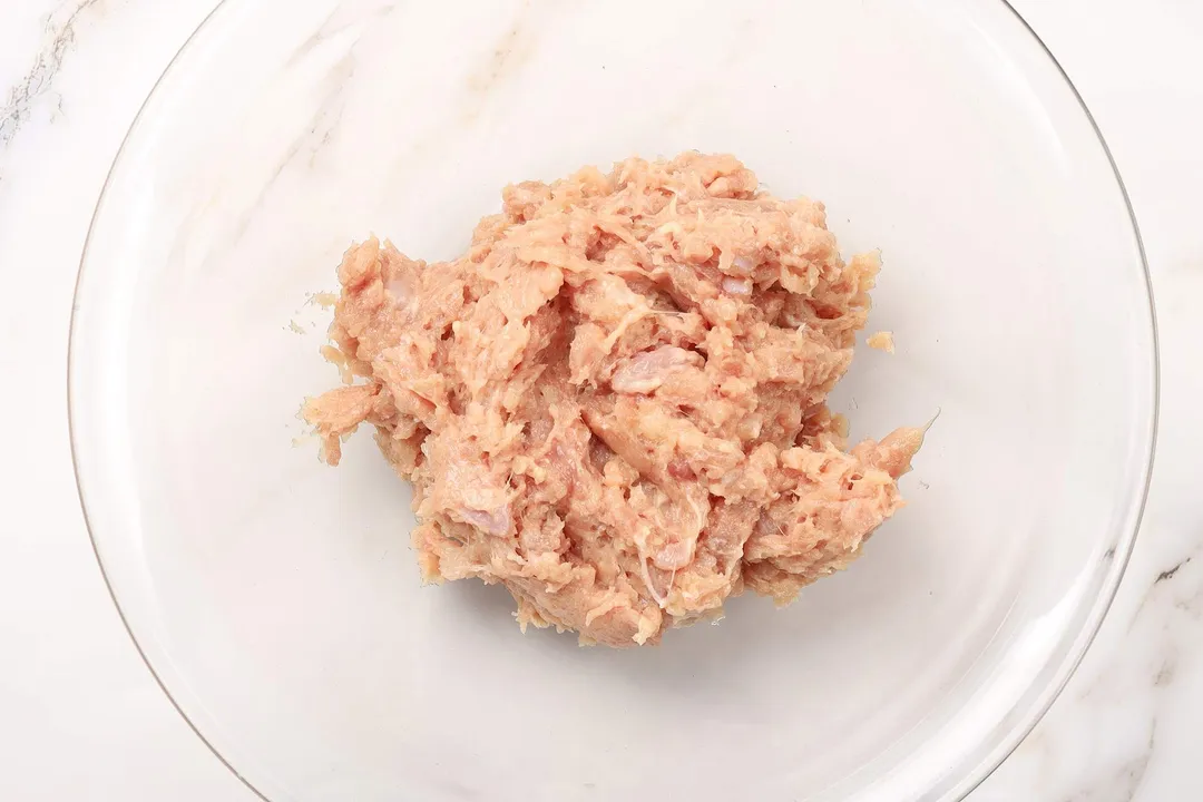 blended meat in a large glass bowl