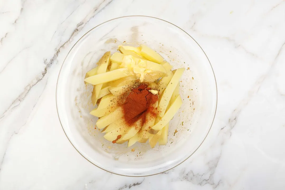 potatoes batonnet with spice in a glass bowl