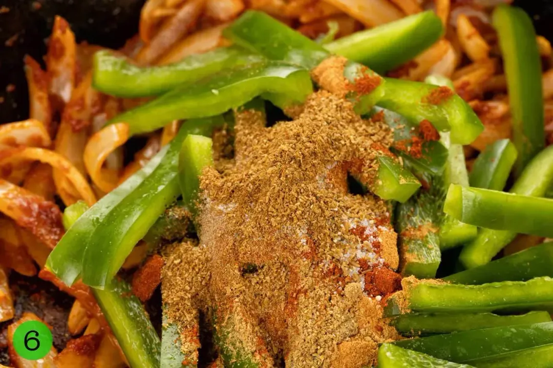 A close-up of vegetable sticks covered in spices