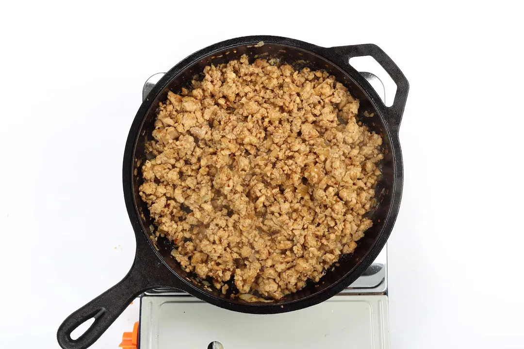 A skillet filled with brown cooked ground meat