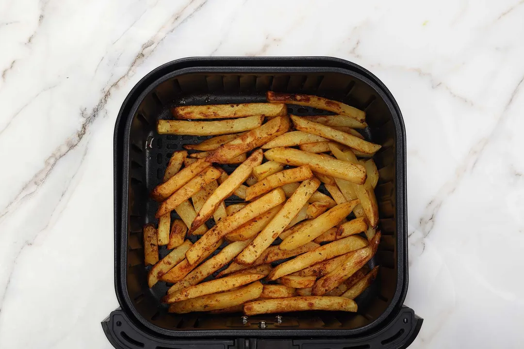 potatoes batonnet in an air fryer basket