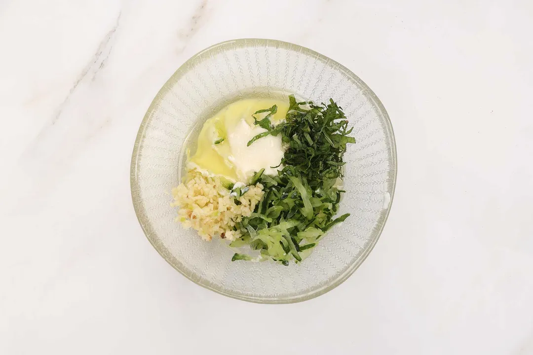 yogurt, mint, olive in a small bowl