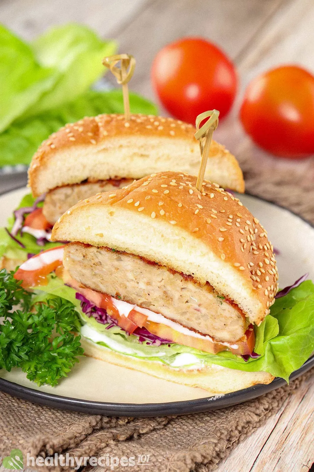 Two halves of a hamburger placed on a plate