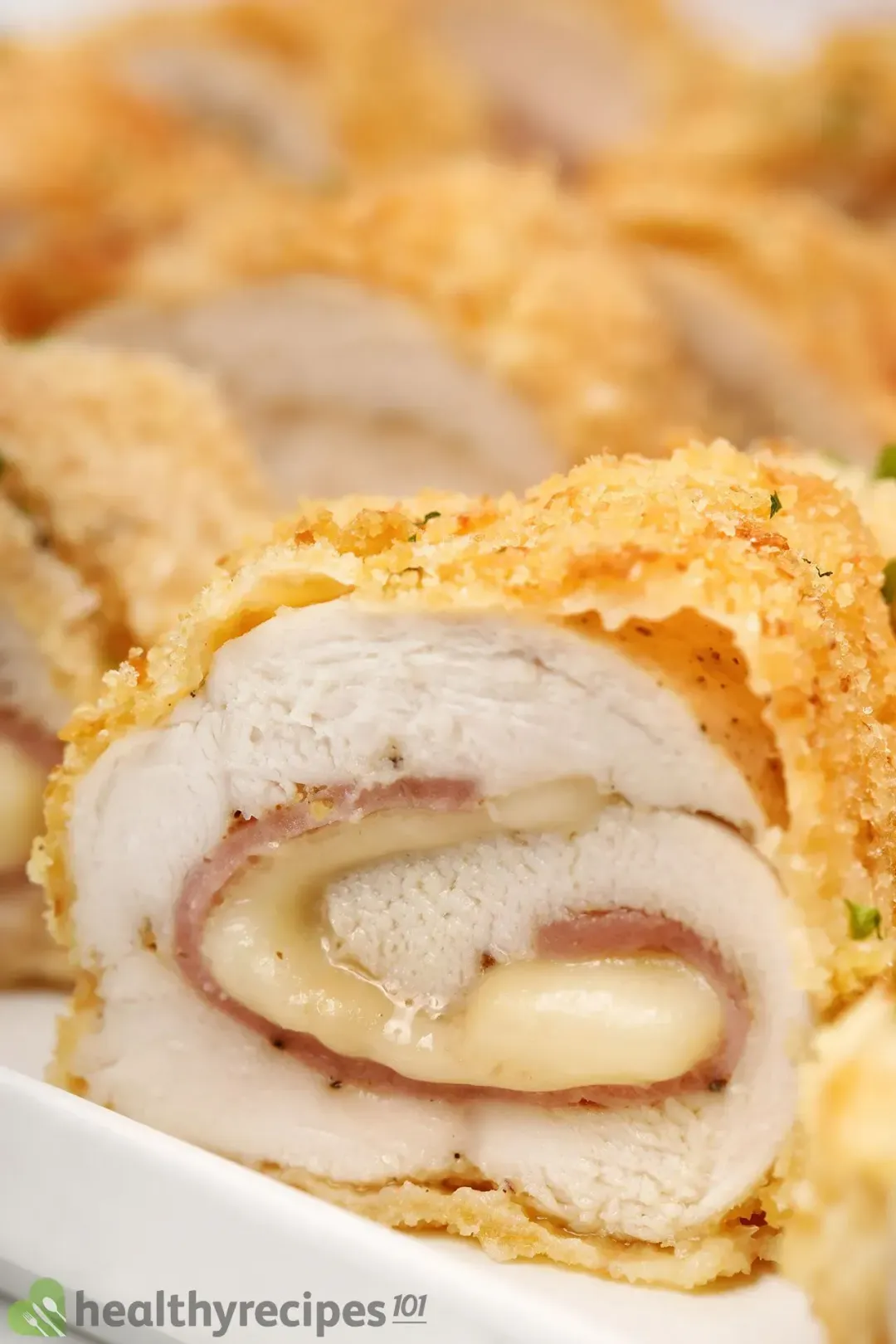 Slices of chicken cordon bleu rolled up with ham and cheese, coated in crispy breading