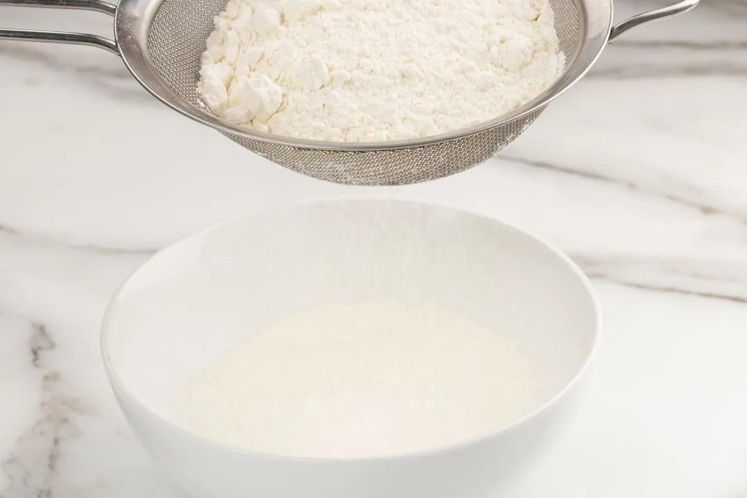 step 2 sift flour on top of a glass bowl