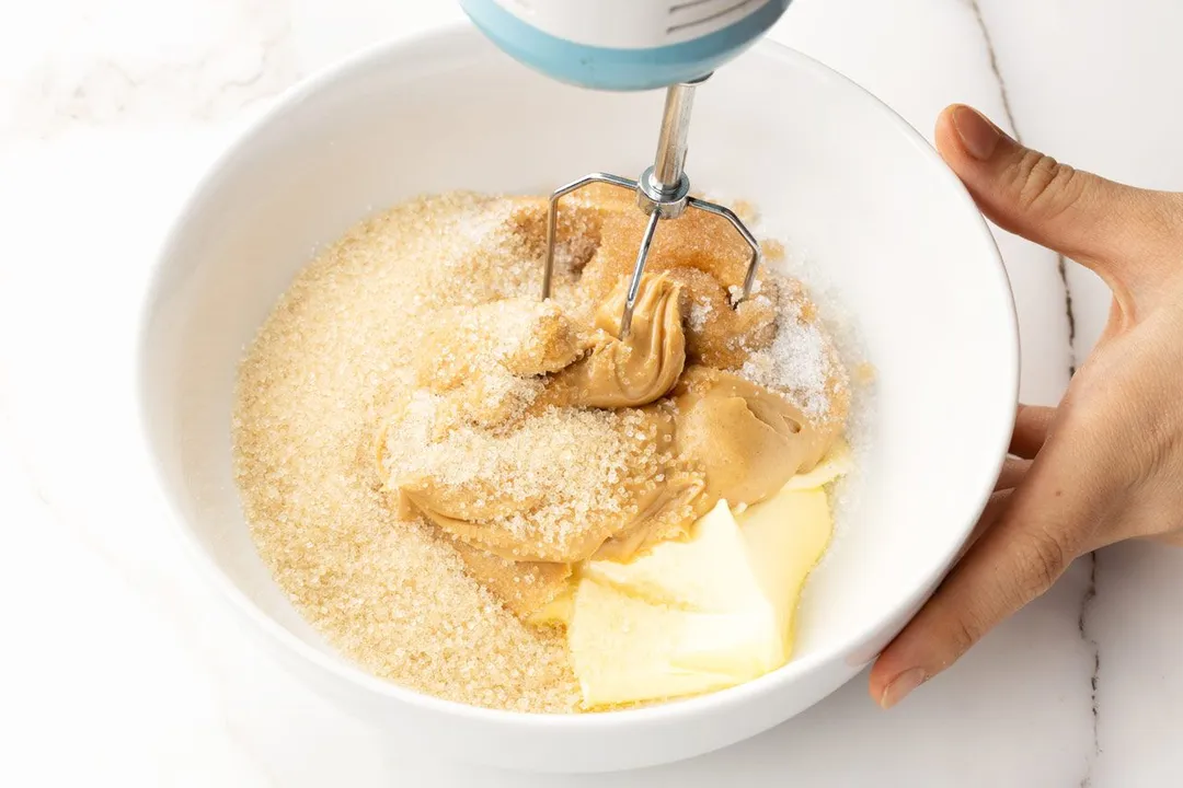 mix butter, peanut butter and sugar in a bowl by a electric mixer