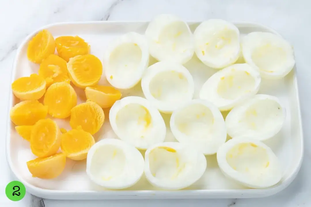 Boiled eggs cut in half and with the yolks separated and put on one side