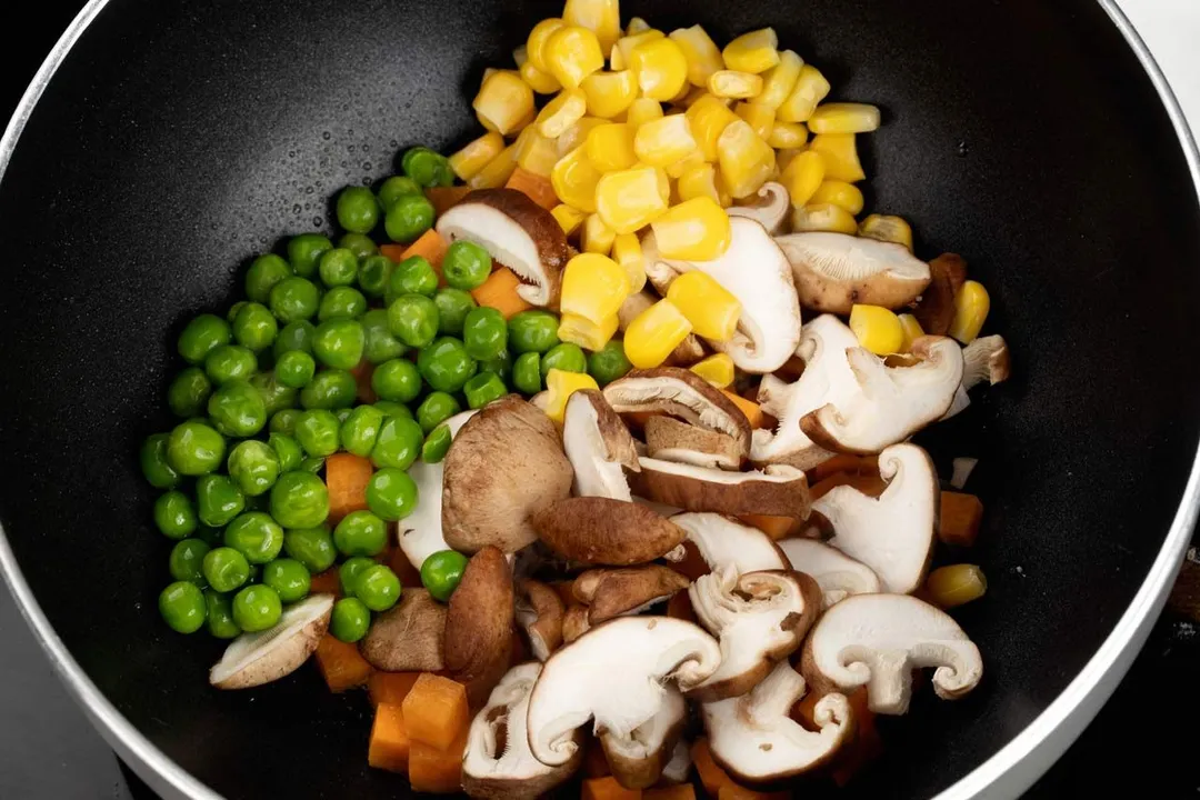 corn, peas and mushroom in a nonstick skillet