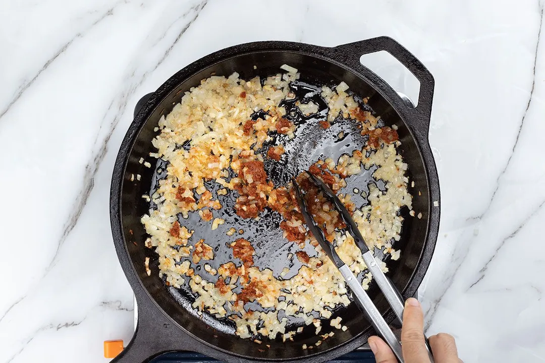 cooking onion in a skillet