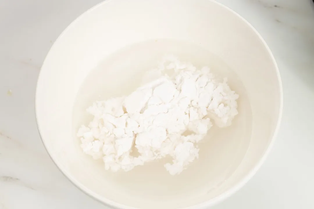 cornstarch and water in a white bowl