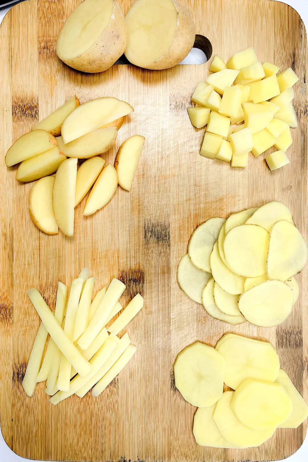 potato cuts: chopped, minced, diced, sliced... on a cutting board