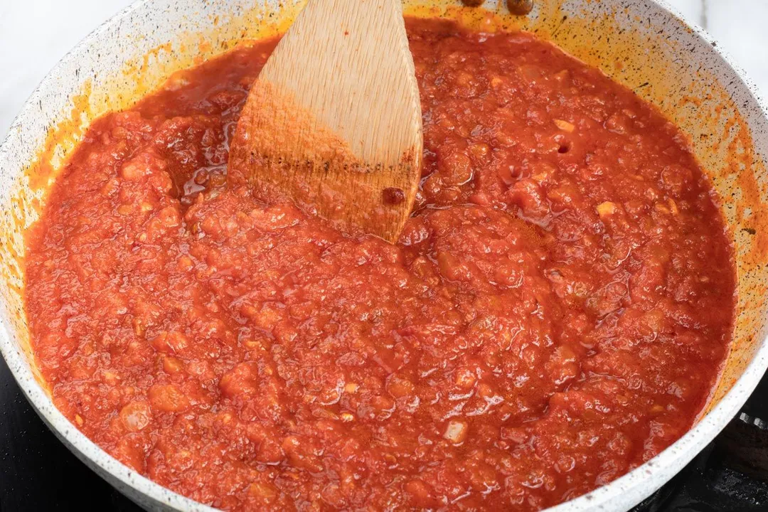 cooking tomato sauce in a skillet