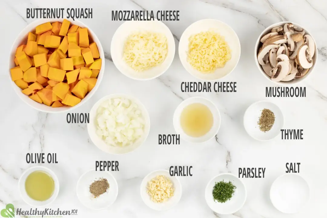 Ingredients in separate bowls: peeled and cut butternut squash, cheeses, onions, mushrooms, and seasonings 