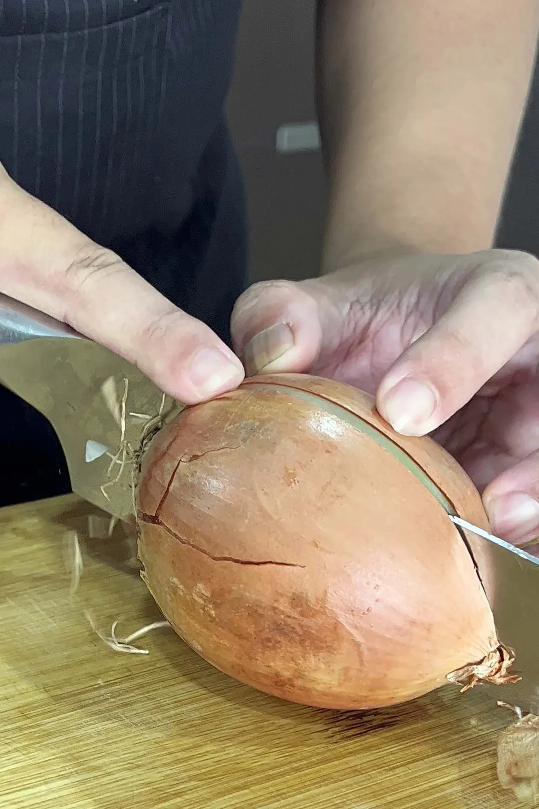 slicing an onion in half