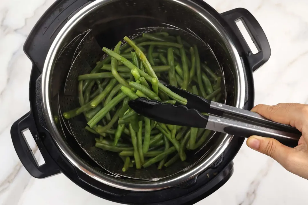 Release the steam and transfer the beans to a plate