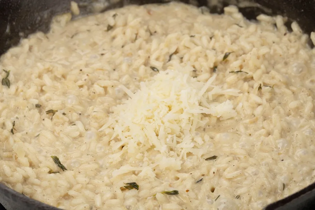 add shredded parmesan cheese to Arancini