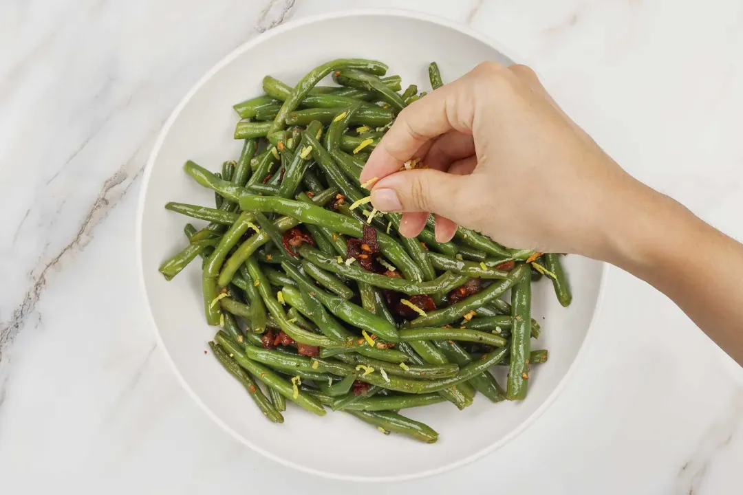 Transfer the green beans to a plate and Garnish