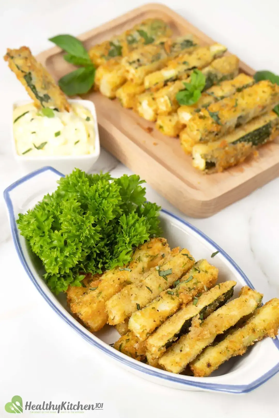 Zucchini fries served with vibrant parsley and mayonnaise dipping