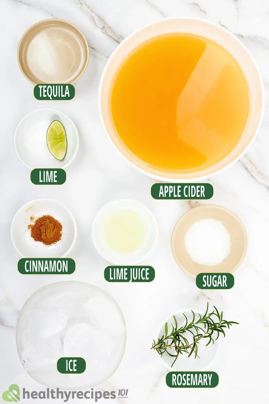 Ingredients in separate bowls: apple cider, ice, sugar, lime juice, rosemary sprigs, and sugar