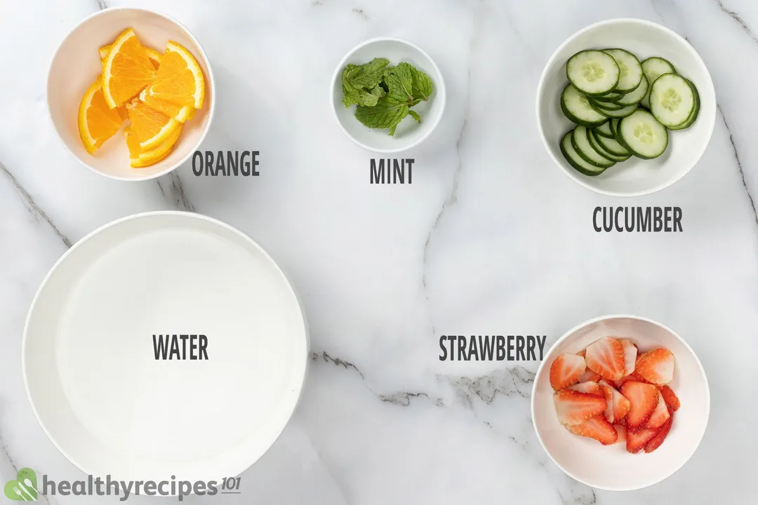 Cucumber Water Ingredients: slices orange, slices cucumber, half strawberries, mint leaves