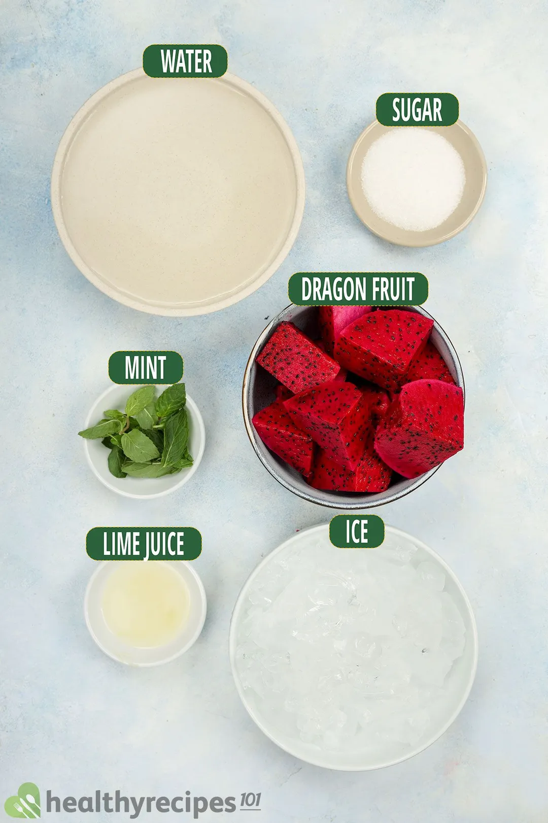 Ingredients for dragon fruit juice, including bowls of dragon fruit, water, mint leaves, ice, lime juice, and sugar.