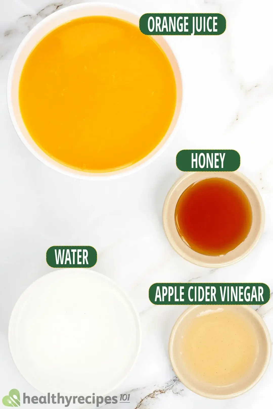 Ingredients in separate bowls: orange juice, honey, apple cider vinegar, water