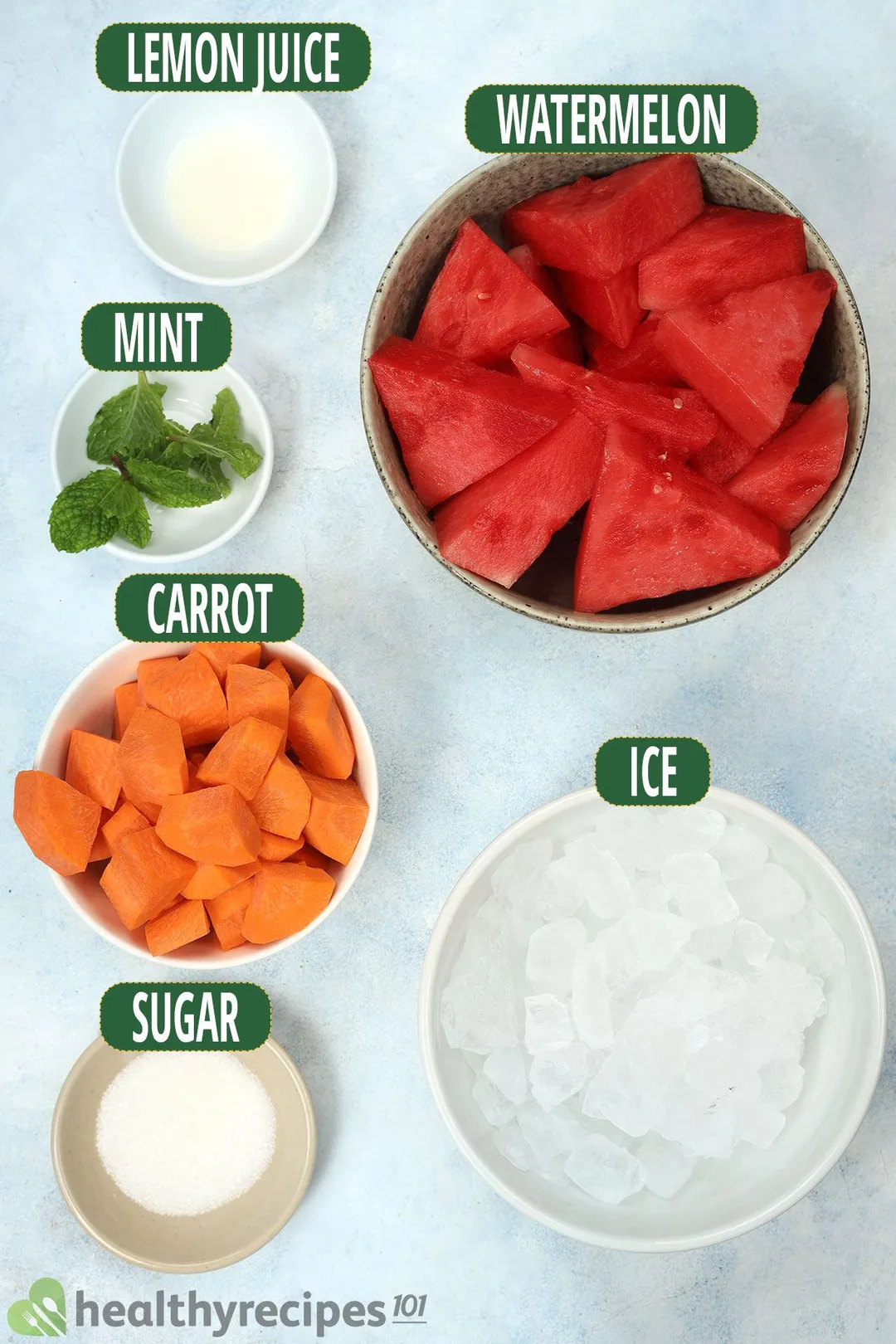 Ingredients for Watermelon Carrot Juice, including bowls of watermelon slices, carrot cubes, ice, sugar, mint leaves, and lime juice.