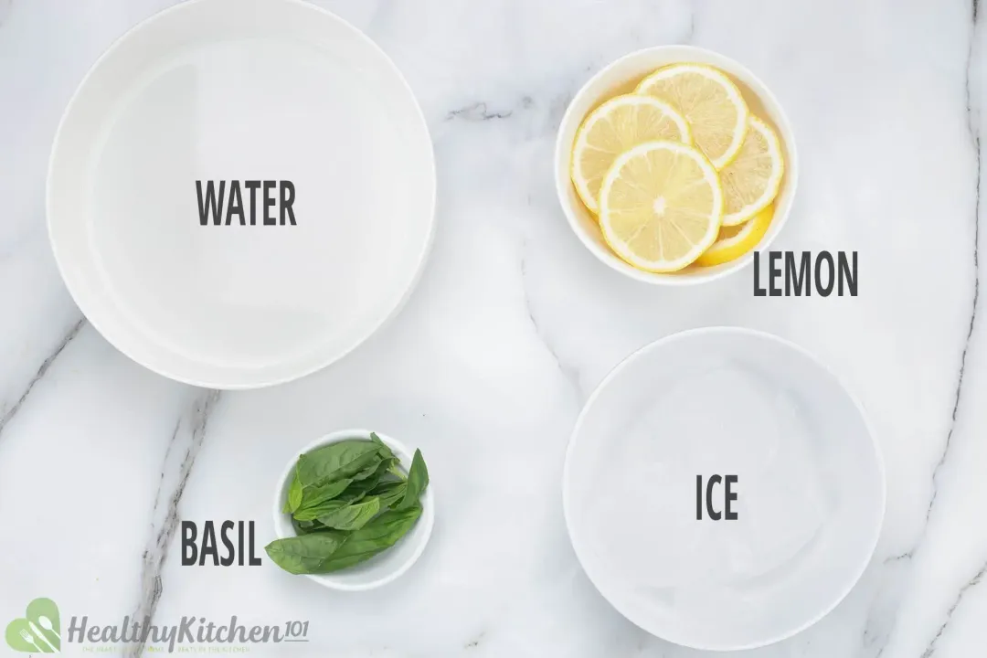Ingredients in separate bowls: water, lemon wheels, basil leaves, and ice nuggets
