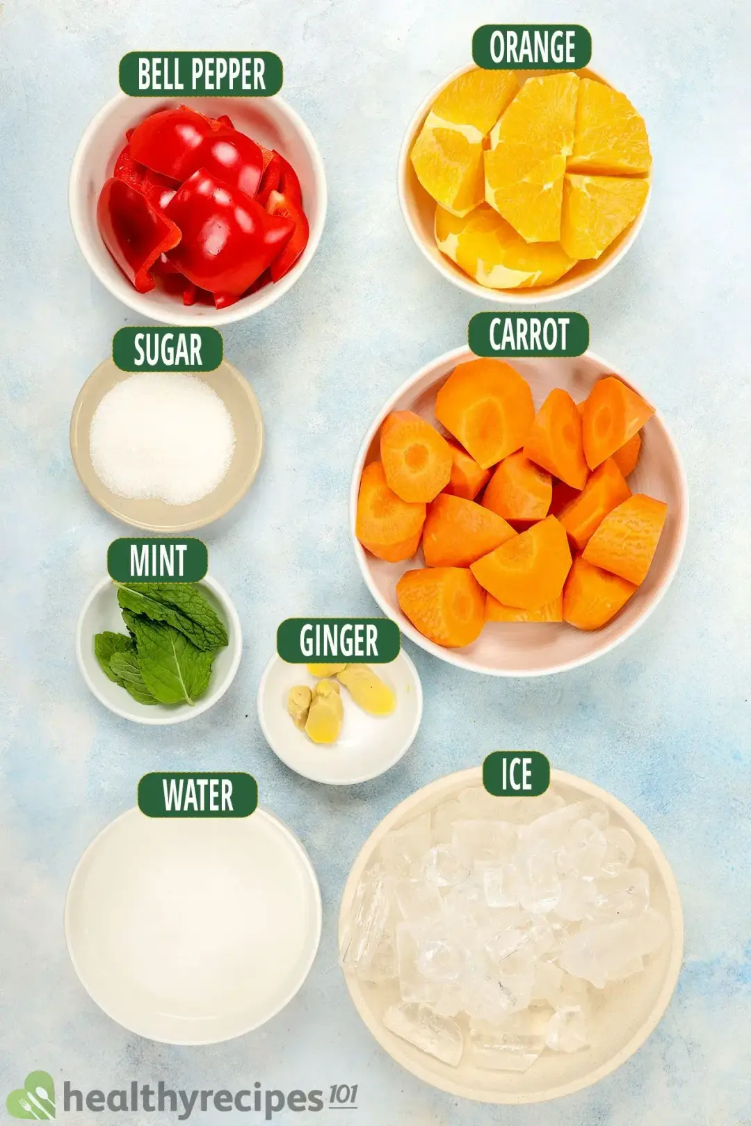 Ingredients in separate bowls: chunked red bell pepper, orange wedges, carrot chunks, sugar, mints, ice nuggets, water, and a ginger knob