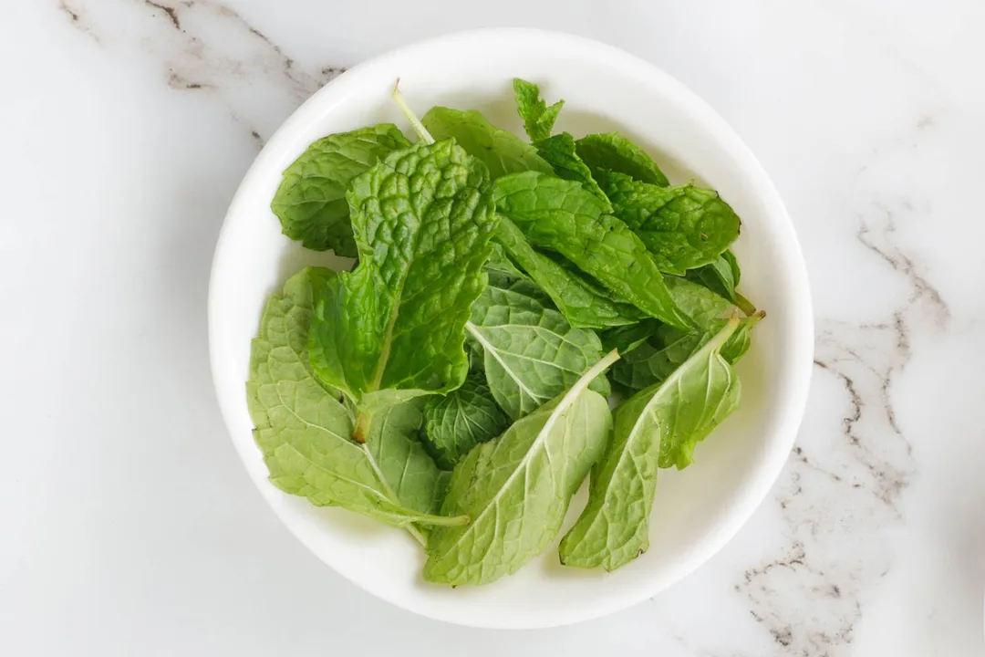 a small bowl of mint leaves