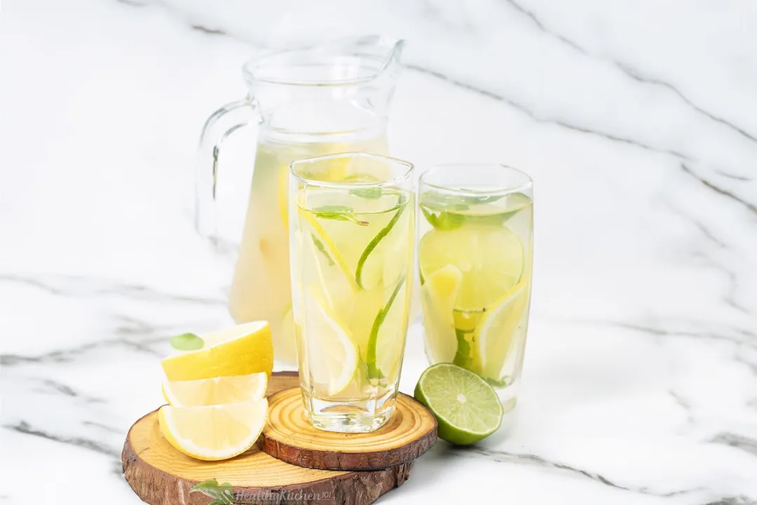 two glass and a pitcher of ginger water