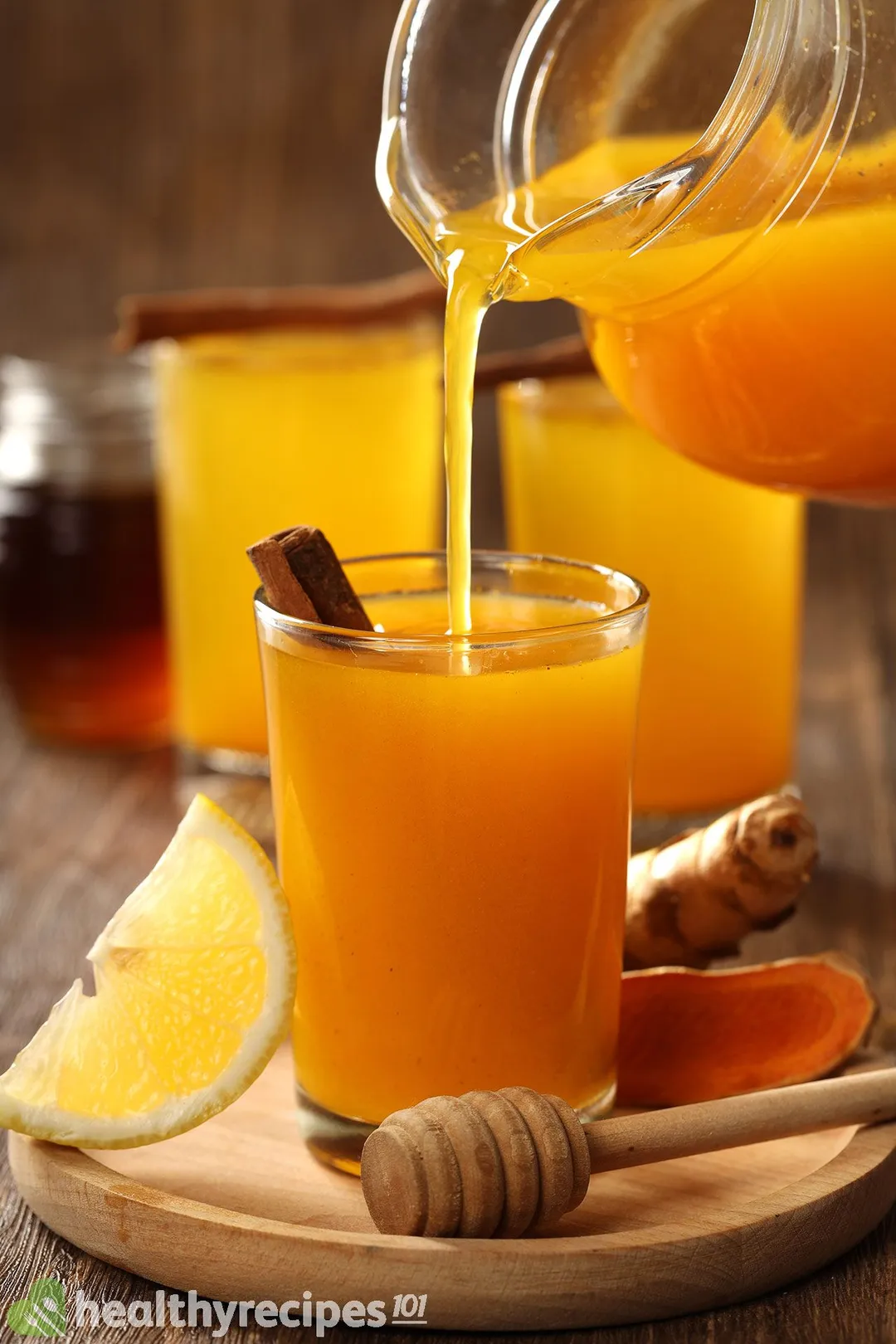 two glass of turmeric and lemon juice on a tray