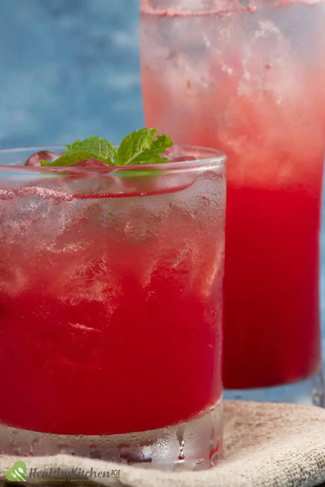 A close-up shot of two glasses of watermelon juice