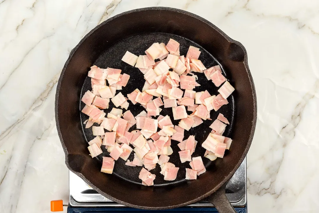 cooking bacon in a cast iron skillet