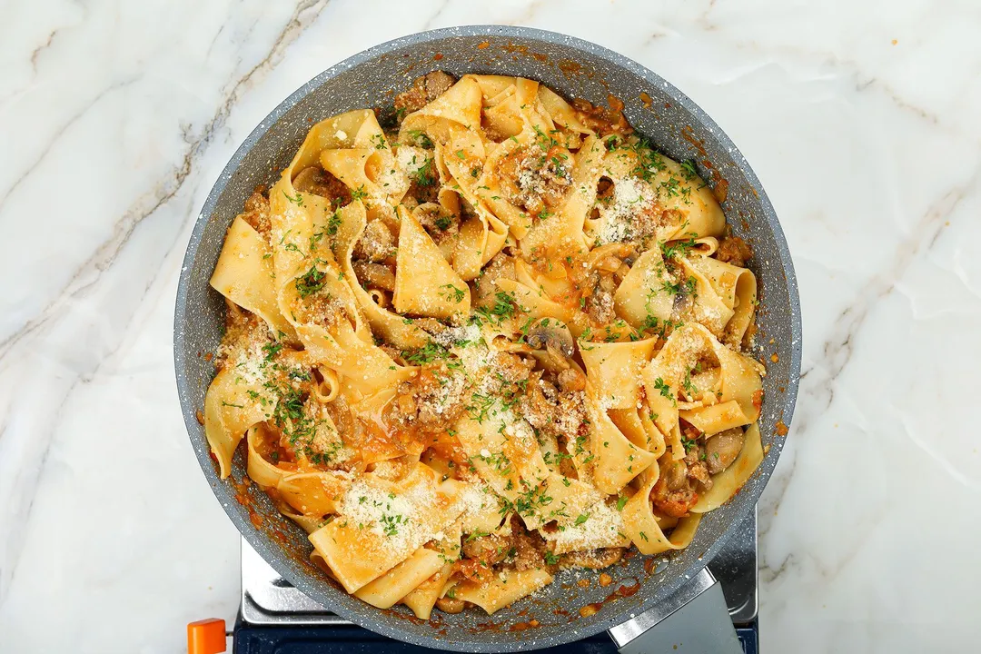 a skillet of cooked pasta and sauce