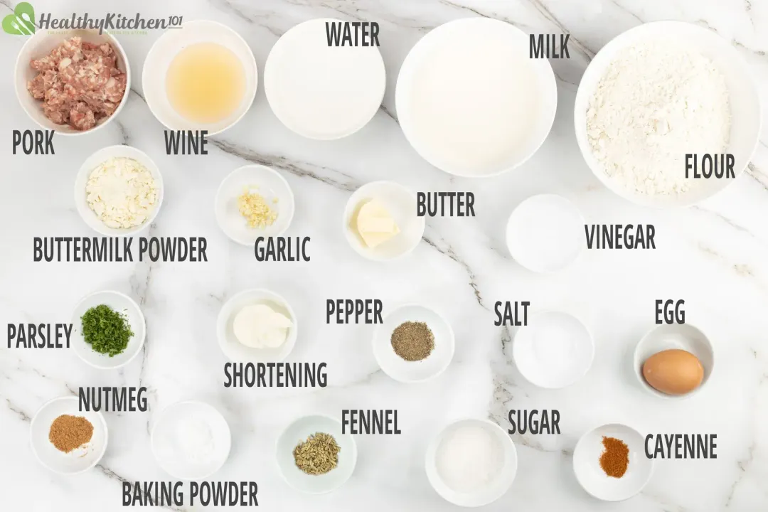 Ground meat, flour, milk, and spices in different bowls for making biscuits and gravy