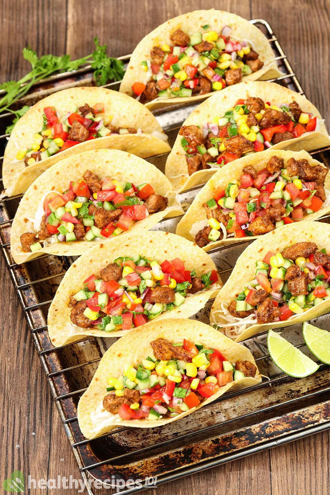 a tray of cooked pork tacos