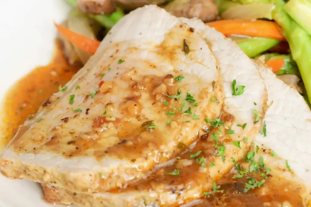 Serve pork loin with vegetables and sauce