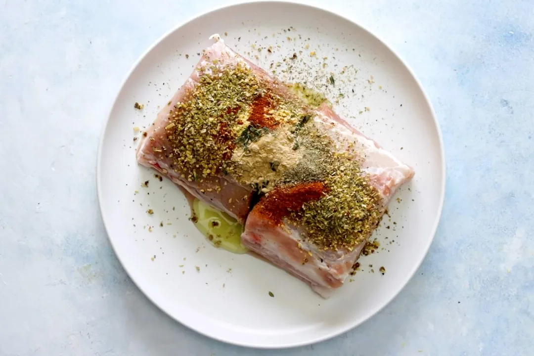 pork loin and seasoning on a plate