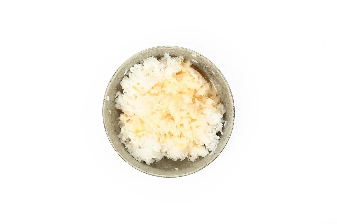 a bowl of rice and oil