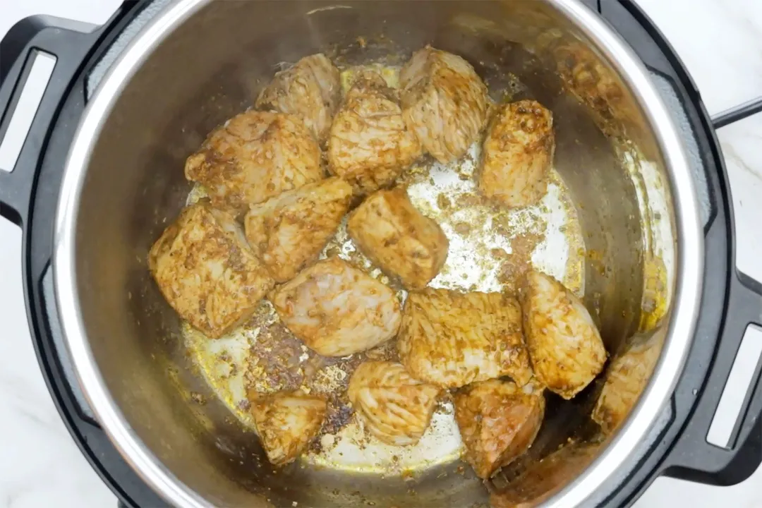 pork chunks cooking in an instant pot