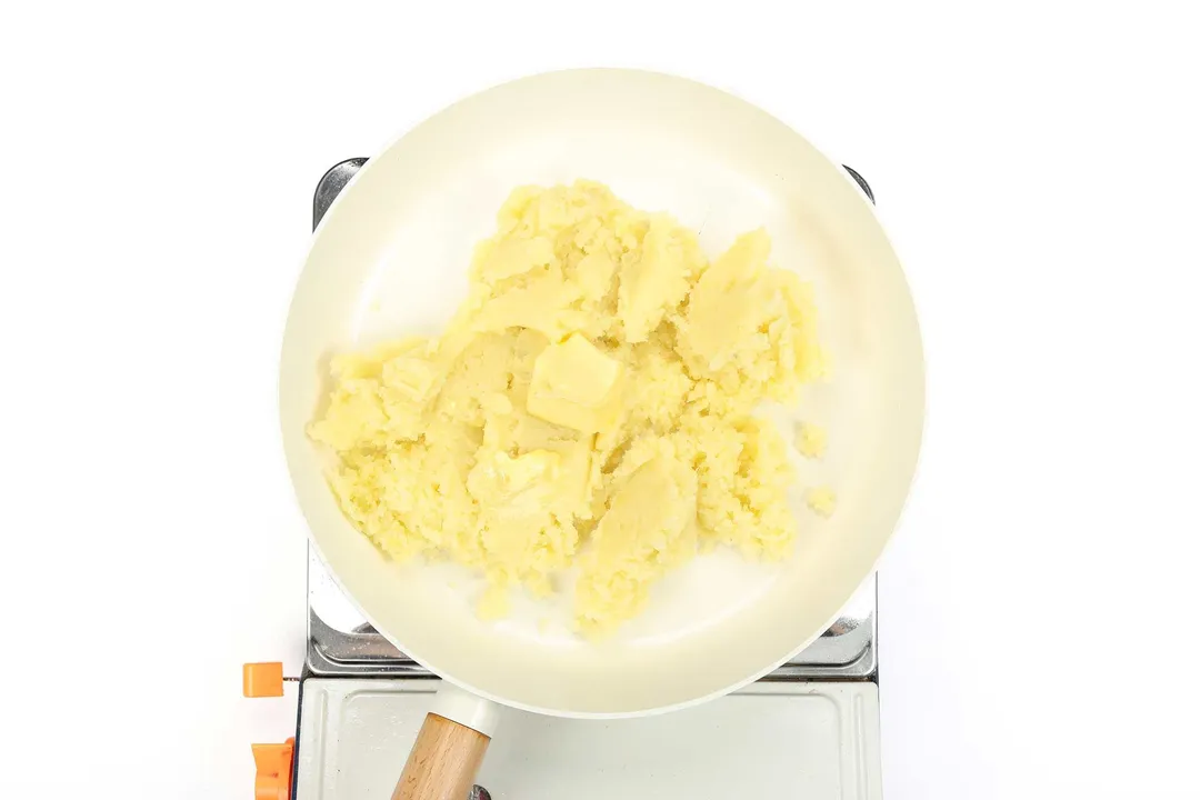 mashed potatoes cooking in a nonstick skillet