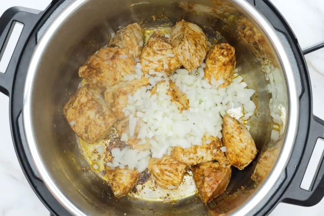 cooking pork chunks and diced onion in an instant pot