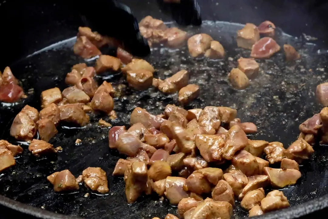 chopped chicken liver cooking in skillet