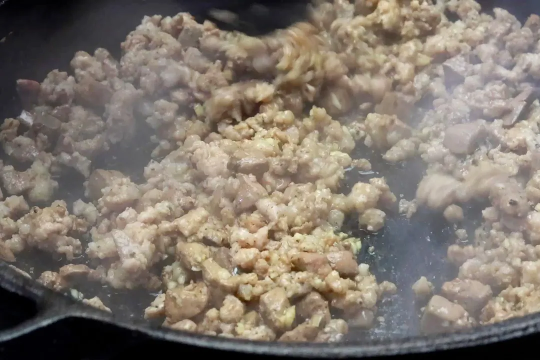 cooking ground pork in a skillet